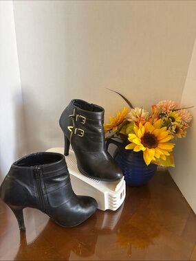 me too Black Leather Ankle Booties with Gold Buckle Accents